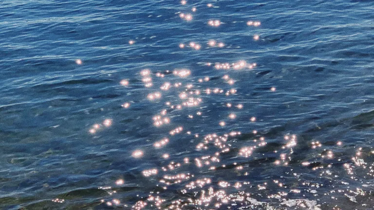 Sunlight reflecting on blue ocean water.