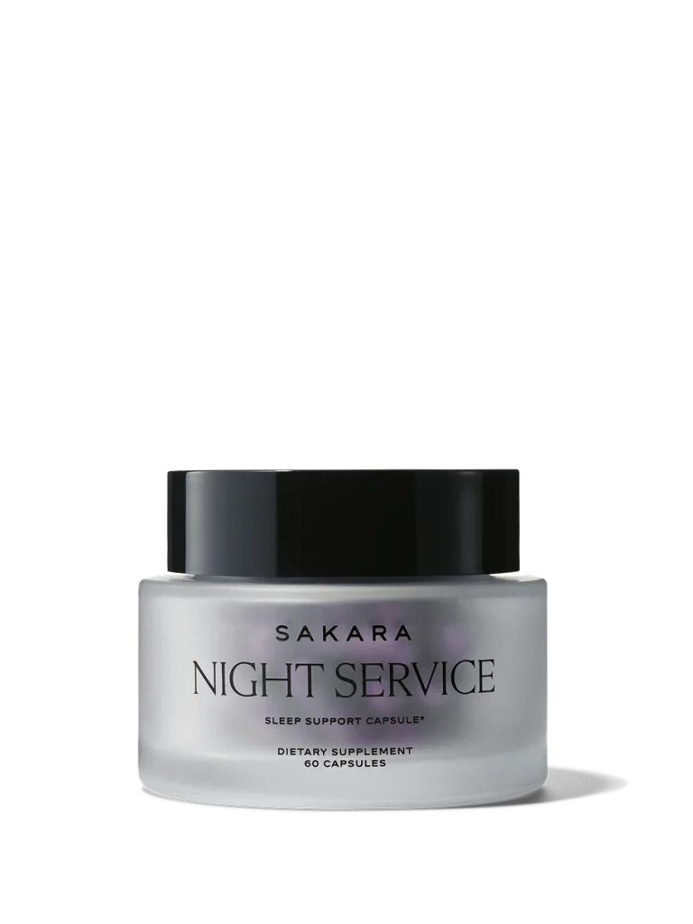 Sakara Night Service sleep support capsules in frosted white glass jar with black lid and black text, 60 capsules dietary supplement