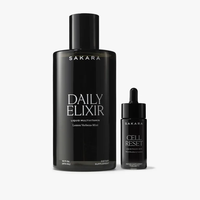 Black bottles of Sakara Daily Elixir liquid multivitamin and Cell Reset liquid multivitamin displayed side by side on a white background.