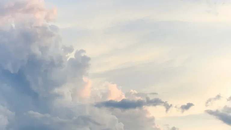 Soft pastel sky with clouds at sunset.