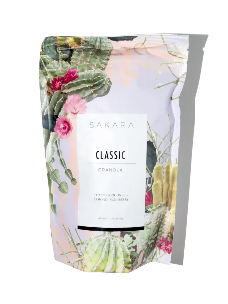 Sakara Classic Superfood Granola in resealable cactus and floral print pouch, toasted coconut almond goji berry flavor, 11.5 oz (326 g).